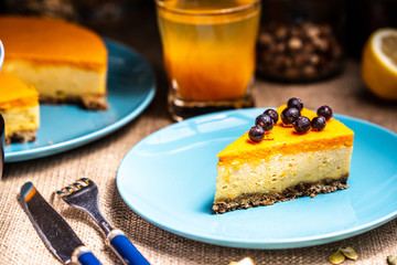 Cheesecake slice on a blue plate
