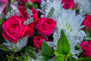 A bouquet of flowers on a wooden bench. Bouquet for the holiday. Ready bouquet of different flowers.