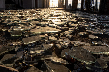 Shattered glass in corridor of abandoned building