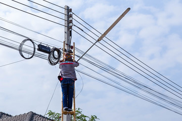 The cable lines on electric power pole people.