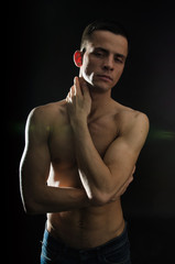 Fototapeta premium Young sexy guy with a beautiful body.
