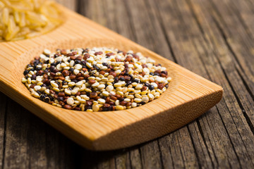 quinoa seeds, old wooden table