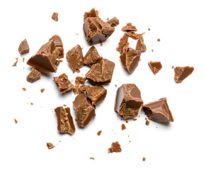 Milk organic chocolate pieces isolated on white background