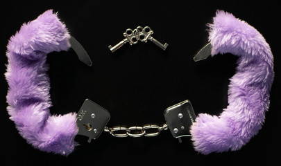 Purple handcuff with key
