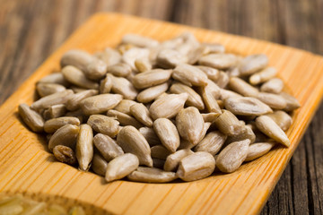 peeled sunflower seeds, old wooden
