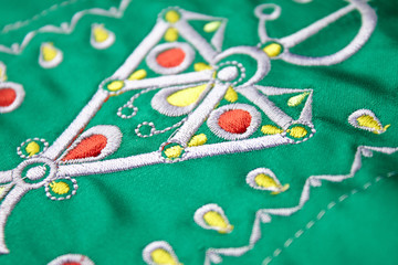 berbere embroidery design on green cloth