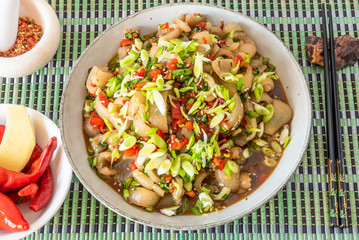 Traditional Asian appetizer - spicy sliced grilled pork skin. Chinese and Thai dish.