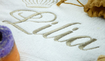 text & letters embroidered on towels