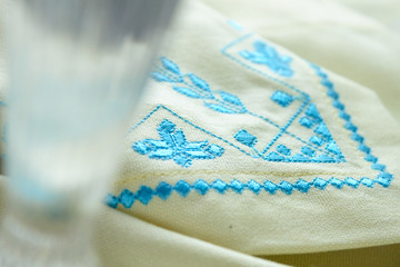 blue embroidery on white kitchen towel