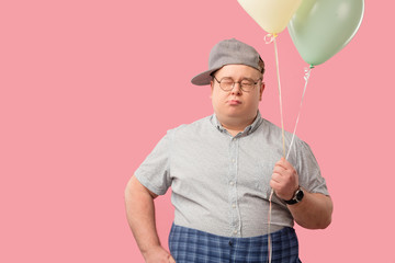 Happy funny plump male animator, much similar to Winnie the Pooh with air baloons isolated over...