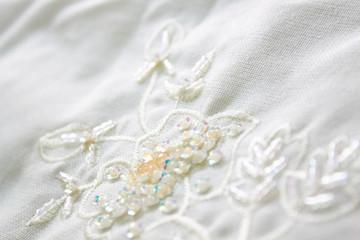 elegant embroidery design on a white pillow