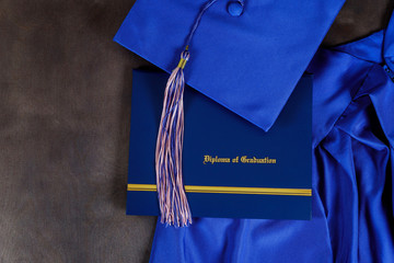 Graduation hat and diploma certificate front view