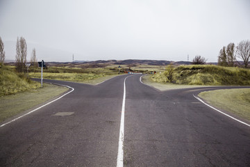 highway road with grass under sky