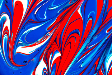 Abstract seamless background of red, white and blue liquid paint swirls