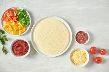 Preparing individual pizzas from pizza bar