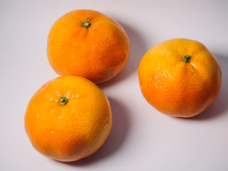 Ripe oranges mandarins isolated in white background.