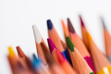 shot of pencils of different colors on a white background, with a small depth of field, macro.