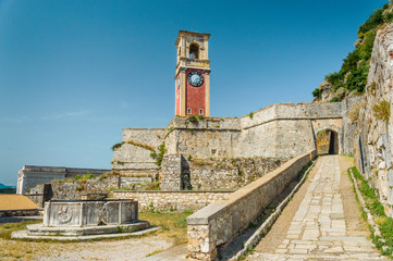 Fototapeta na wymiar Corfu, Kerkyra Clock Tower in the old fortress on the seashore.