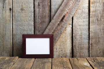 picture frame blank paper at rustic wooden interior