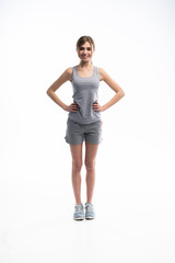 Young sporty Caucasian female model isolated on white background in full body