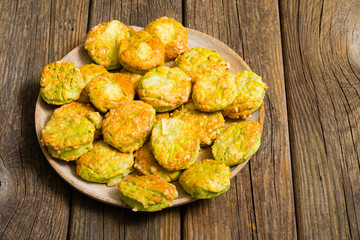 homemade baked scone cakes from fresh ramson leaves and cheese, old wooden texture