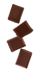 Milk chocolate pieces isolated on white background