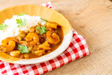 Shrimps in curry sauce on rice