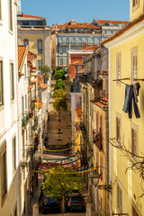 Fototapeta na wymiar Narrow streets of Bairro Alto quarter, central district of the city of Lisbon, Portugal