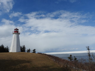 Fototapeta na wymiar lighthouse on the coast, ice flow, ocean,
