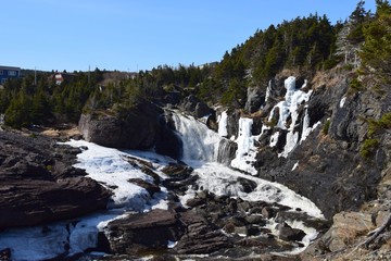 river and waterfall landscape along he East Coast trail, Stiles Cove Path near Flatrock Newfoundland Canada; early Spring 