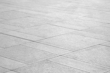 Paving stones background. Road texture black and white. Stone flooring. Stone covering on the square.