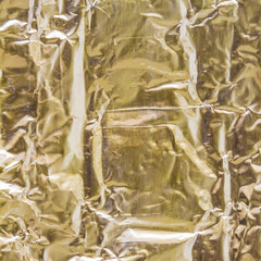 Gold Paper creased and folded to provide a textured background