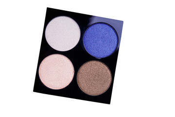 Set of four round eye shadow in a plastic black box isolated on white background