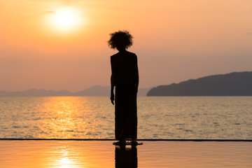 Sunset point with modern scary old woman silhouette sculpture in Ao Nang, Krabi, Thailand