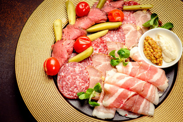 Party Platter of Assorted Cured Meats with sauce and pickles