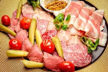 Party Platter of Assorted Cured Meats with sauce and pickles