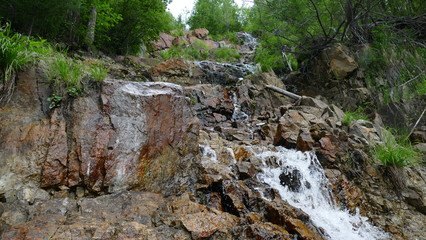 Waterfall among stones and rocks
