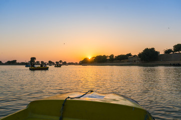 Shot from boat of sunset at gadi sagar lake jaisalmer
