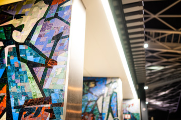 Mosaic wall art on the bus and train station / public transport hub in the city center of Tilburg, Noord Brabant, Netherlands.