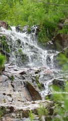 Waterfall among stones and rocks