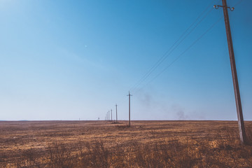 Power lines passing through the field