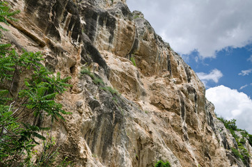 Sunny Blue Sky, rock and a hill near the village Krasen