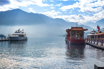 boat and speed boat pier in sunrise morning at Sun moon lake , taiwan - 259909887