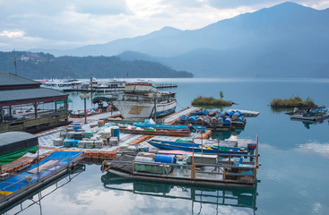 boat and speed boat dock yard in sunrise morning at Sun moon lake , taiwan - 259911237