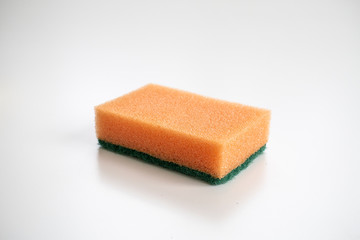 Isolated orange sponge on the white background