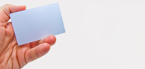 Fototapeta premium man hands holding an empty card on a white background. free space for advertisements.
