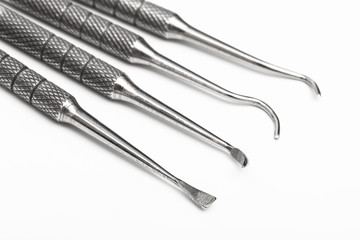 tools for dental treatment on white background