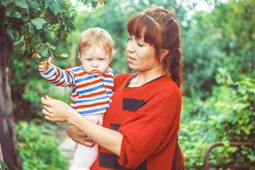 Mum the child on hands greens