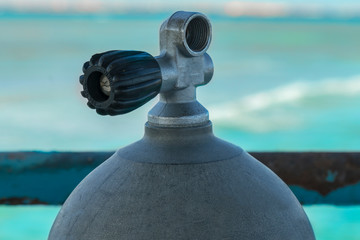 diving cylinder. oxygen cylinder outdoor. Oxygen cylinder for swimming in the background of the sea