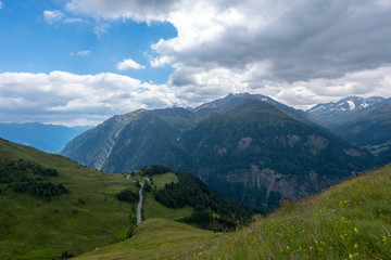 Fototapeta premium Mountain landscape small road clouds